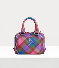 Our Chelsea Bowling bag features a small-sized silhouette in PU leather, adorned with an embossed saffiano finish. The piece receives our signature Union Jack artwork on the interior lining, while the exterior panels adopt the 'Candy Tartan' motif, evoking the wild beauty of the Scottish Highlands that inspires this season's collection. Exterior Panels, Bowling Bag, Wild Beauty, Bowling Bags, Socks And Tights, Scottish Highlands, Union Jack, Cute Bags, Pump Sandals