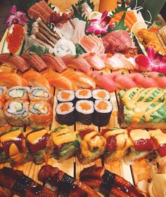 sushi platter with lots of different types of sushi