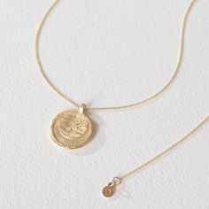 Temple of the Sun Celeste Necklace Solid Gold, hand-crafted in Byron Bay in ethical gold and White Diamonds. Shop fine jewellery and pendant necklaces. Recycled Gold Medallion Necklace With Coin Pendant, Timeless Gold Engraved Coin Necklace, Timeless Engraved Gold Coin Necklace, Yellow Gold Coin Pendant Necklace In Sterling Silver, Everyday Engraved Yellow Gold Coin Necklace, Celestial 14k Gold Coin Pendant Jewelry, Yellow Gold Brass Coin Necklace With Delicate Chain, Yellow Gold Moon-shaped Jewelry With Delicate Chain, Minimalist Engraved Yellow Gold Coin Necklace