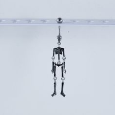 a metal skeleton hanging from the ceiling