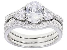 Bella Luce ® white diamond simulant 3.42ctw oval, heart, and round, rhodium over sterling silver ring with bands. Measures approximately 0.75"L x 0.38"W and is not sizeable. The diamond equivalent weight is 2.09ctw. Silver Diamond Oval Bridal Sets, Oval Silver Diamond Bridal Sets, Oval Silver Bridal Sets, Classic Oval Bridal Sets With Brilliant Cut, Diamond Simulant, White Diamond, Sterling Silver Ring, Silver Ring, Sterling Silver Rings