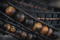 "Mens leather wrap bracelet with fantastic matte Tiger Eye, tiny faceted Hematite. Wrap is woven on genuine leather cord and finished with a small metal button. Wraps around an average man's wrist three times. ⇒ GEMSTONE MEANINGS ♡ Tiger's Eye is a stone of protection that is also very stabilizing and grounding. It enhances integrity, willpower, self-confidence, practicality and correct use of power. It is a stone that enhances good luck, and brings prosperity, often in the form of money. Tiger' Hematite Bracelet, Gemstone Meanings, Bracelet Mens, Tiger Eye Bracelet, Bracelet Leather, Tiger Eye Beads, Mens Leather Bracelet, Miyuki Beads, Eye Bracelet