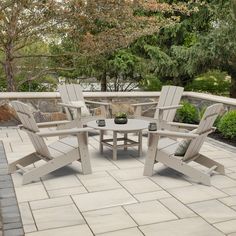 three chairs and a table on a patio