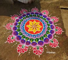 a colorful flower design painted on the ground