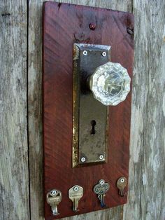 an old door handle with some knobs on it