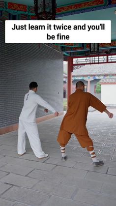 two men in orange and white outfits are playing frisbee