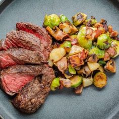 steak, brussel sprouts and brussels sprouts on a plate