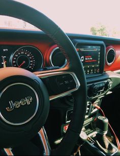 the steering wheel and dashboard of a car