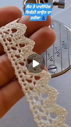 a person is holding a piece of lace in their left hand, and there is a video about how to crochet