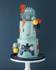 a blue cake with video game controllers on it