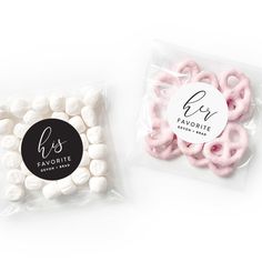 two bags filled with white and pink pretzels next to each other on a white surface