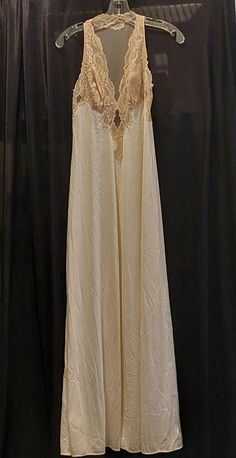 Vintage Glydons Hollywood Small Lace Bodice Full Nightgown Slip Description Beautiful Glydons Hollywood Vintage Women's Lace Full Slip Nightgown Size: Small Color: Beige Material: Nylon Gorgeous, elegant.... nightgown slip. Delicate scalloped lace bodice. Slips over the head. This item is in very gently used condition. We hand select our used items very carefully and only list those with little to no obvious signs of wear. Items will arrive from a smoke-free/pet-free environment. Size Small Measures 13 inches from armpit to armpit laying flat 54 inches long from top of the shoulder to bottom hem Please feel free to message me with any questions and/or to request additional photos. Elegant Nightgown, Slip Nightgown, Hollywood Vintage, Vintage Slip Dress, Vintage Slip, Vintage Nightgown, Vintage Slips, Women's Nightgowns, Nightgowns