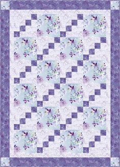 a blue and white quilt with purple flowers on the center, in front of a checkerboard background