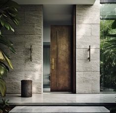 an entrance to a modern home surrounded by greenery