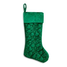 a green christmas stocking hanging from the side on a white background with clipping for text