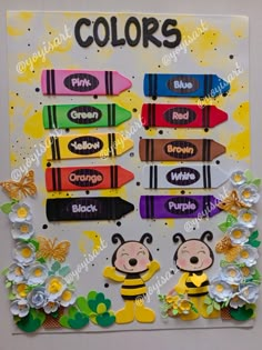 an art project with crayons and flowers on the side, including two bees