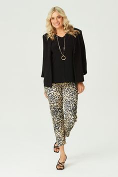 Step out in style with the In the Wild 7/8 Stretch Pant in Black Mix. Featuring a bold animal print, these pants offer a chic and modern look. The 7/8 length and pull-on design with a drawstring waist tie provide comfort and ease. Front stitch rounded jean pockets add a touch of practicality to this fashionable piece. Printed animal design 7/8 length Pull-on style Drawstring waist tie Front stitch rounded jean pockets Our Model Chella is wearing a size XS. She is 175cm tall with an 89cm bust, 74cm waist and 96cm hips. Chic Leopard Print Workwear Bottoms, Chic Leopard Print Pants For Work, Trendy Leopard Print Pants For Work, Jean Pockets, Cardigan Vest, Stretch Pants, Pant Shirt, Waist Tie, Leisure Wear