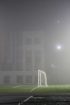 a soccer goal on a foggy night