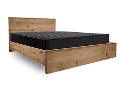 a wooden bed with black mattress and headboard