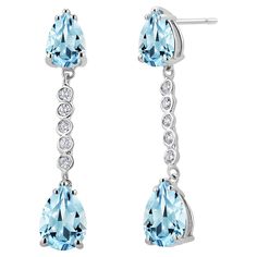 Introducing our stunning Four Pear Aquamarine Diamond 4.40 Carat 14 Karat White Gold 1.42 Inch Linear Earrings – a true masterpiece of elegance and sophistication. These exquisite earrings are a perfect addition to your jewelry collection, whether you're dressing up for a special occasion or simply adding a touch of luxury to your everyday style. Design: These earrings feature a delicate and timeless linear design, measuring a graceful 1.42 inches in length and 0.27 inch in width, which beautifully elongates the neck and frames your face. Gemstones: The centerpiece of these earrings is the four pear-shaped Aquamarine gemstones. Each Aquamarine gemstone boasts a captivating shade of blue, reminiscent of the clear waters of the Caribbean. The combined carat weight of these Aquamarine gemston Linear Earrings, Round Sapphire, Linear Design, Aquamarine Gemstone, Stylish Jewelry, Exquisite Jewelry, The Caribbean, Quality Diamonds, Real Diamonds