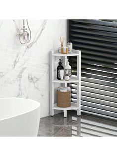 a white bathroom shelf next to a bath tub