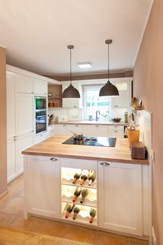 a kitchen filled with lots of bottles of wine