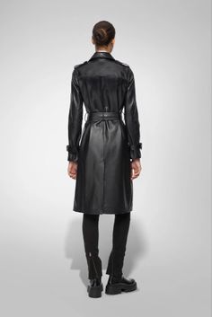 Women's Trench Leather Coat In Black With Belted Waist Step into elegance with our women's trench leather coat in black. This exquisite coat is crafted from semi-aniline cowhide leather, offering both luxury and durability. The classic turn-down collar, belted waist, and button closure provide a sophisticated silhouette, while open hem cuffs with straps add a refined touch. Complete with one inside pocket and two side pockets, this trench coat is the epitome of chic functionality, perfect for any occasion. Outer Shell: Genuine Leather Leather Type: Cowhide Leather Finish: Semi-aniline Feature: Belted Waist Closure Style: Button Collar Style: Turn Down Cuffs Style: Open Hem With Straps Inside Pockets: One Outside Pockets: Two Side Pocket Color: Black Sleek Leather Belted Outerwear, Luxury Leather Jacket With Belt, Luxury Leather Belted Leather Jacket, Luxury Leather Belted Jacket, Black Belted Leather Jacket For Formal Occasions, Luxury Long Leather Jacket With Belt, Luxury Black Belted Outerwear, Luxury Long Belted Leather Jacket, Luxury Black Leather Jacket