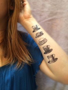 a woman with a tattoo on her arm that has coffee cups and mugs on it