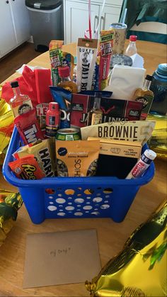 a blue basket filled with lots of snacks