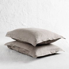 two pillows sitting on top of each other