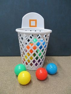 a basket filled with colorful balls on top of a table