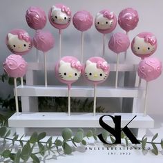 hello kitty lollipops are arranged on a table