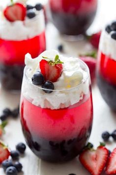 three glasses filled with red, white and blue dessert