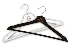 two black and white hangers with bow ties