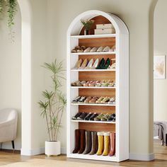 a white shoe rack filled with lots of shoes