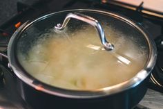 a pot with boiling water on the stove