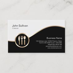 a black and white business card with gold trimmings on the front, featuring utensils