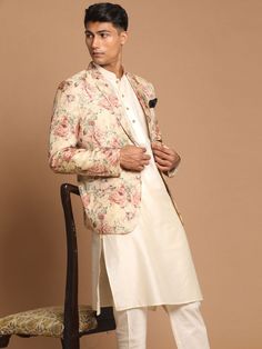 Vastramay Men's Beige Floral Print Blazer And Cream Solid Kurta With Pajama Set Designer Cream Sets For Festivals, Designer Festive Sets For Groom, Designer Cream Sets For Transitional Season, Designer Semi-formal Sets For Diwali, Designer Beige Festive Sets, Festive Semi-formal Silk Suits, Fitted Beige Lawn Suit For Formal Occasions, Formal Fitted Beige Lawn Suit, Designer Semi-formal Sets For Festivals