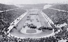 an old black and white photo of a baseball stadium filled with people standing on the field