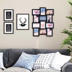 a living room filled with furniture and framed pictures on the wall above it's couch