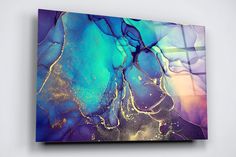 an abstract painting with blue and yellow colors on the canvas, hanging on a wall