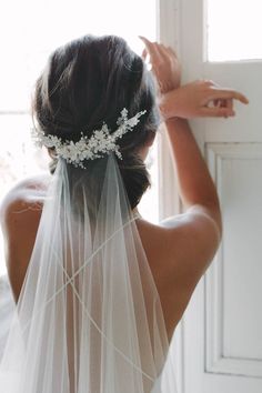 the back of a bride's head wearing a veil