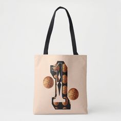 a tote bag with basketballs and the letter j on it's front