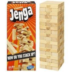 a stack of wooden blocks next to an unopened box of jengga