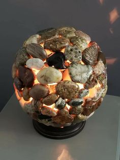 a lamp made out of rocks on top of a table