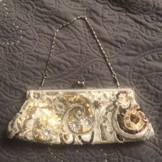 A Truly Unique Evening Bag With Beading In Tan, Brown And Cream. Satin Lining And Silver Chain Complete This Look. Used Only Once And In Brand New Condition This Special Bag Will Take Your Evening Look To A New Level Elegant White Sequined Bags, Embellished Cream Evening Bag For Party, Secret Wallet, Floral Clutches, Embroidered Clutch, Suede Clutch, Pink Mermaid, Michael Kors Wristlet, Embroidered Leather