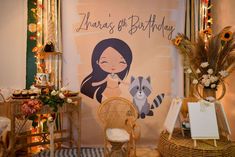 there is a birthday sign on the wall next to a wicker chair and other decorations