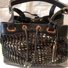 Nwt Gorgeous Vince Camuto Signature Couture Black Woven Leather Handbag With Woven Pull Cord Closure. Gold Tone Hardware. Two Braided Detail Handles. Four Feet At Bottom. Detachable Black Zippered Pouch. Detachable Gold And Wood Vc Handbag Charm. Can Be Used As Is Or With A Colorful Handbag Organizer Or Scarf Inside The Bag. Includes Vc Signature Dust Bag. 10% Discount On Bundle Of Three Or More Itemsp Designer Black Top Handle Bags, Luxury Black Bucket Shoulder Bag, Luxury Black Satchel Shoulder Bag, Luxury Black Hobo Shoulder Bag, Designer Black Bag With Handles, Designer Black Bags With Handles, Black Bucket Bag With Top Handle, Luxury Black Satchel With Removable Pouch, Black Bucket Bag With Detachable Strap And Double Handle