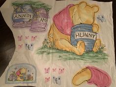 a winnie the pooh t - shirt is on display