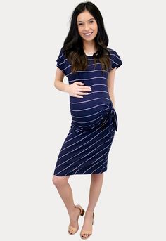 This striped navy maternity dress is here to steal your heart! Features a relaxed short sleeve with a flattering side tie. This dress looks amazing with or without a bump! Constructed of an ultra stretch material, designed with Mama curves in mind. Throw this dress on with your favorite tennis shoes for a fun, casual outfit that is perfect for day to day wear! A total win throughout pregnancy and beyond.  #SexyMamaMaternity #bumpstyle #maternitydresses Striped Short Sleeve Dress With Tie Waist, Summer Pregnancy Outfits, Navy Maternity Dress, Maternity Clothes Summer, Summer Maternity, Pregnancy Looks, Summer Pregnancy, Bump Style, Pregnancy Outfits